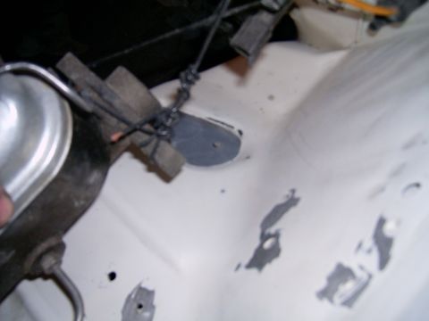 1978 Ford Mustang II - Detail shot of engine bay components, including the brake fluid reservoir and various wires.