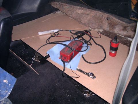 1978 Ford Mustang II - Car interior showing ignition parts and floor panels, not a 1978 Ford Mustang II.