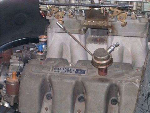 1978 Ford Mustang II - Close-up of a Ford Boss 429 engine intake manifold with a carburetor and fuel pump visible.