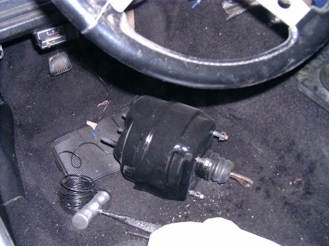 1978 Ford Mustang II - Interior view of a car's dashboard, showing a brake booster and steering wheel.