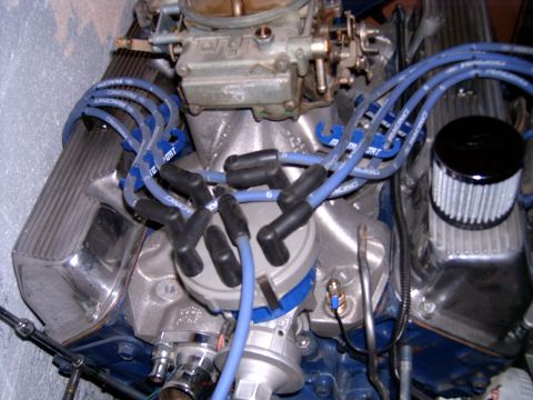 1978 Ford Mustang II - This is a close-up view of a V8 engine, focusing on the carburetor, distributor, and spark plug wires.