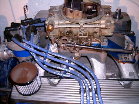 1978 Ford Mustang II - Engine components, including a carburetor and spark plug wires, are visible in this close-up shot.