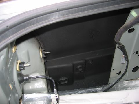 1996 Ford Crown Victoria - Close-up view of the inside of a vehicle's trunk compartment.