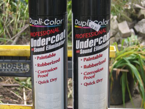 1996 Ford Crown Victoria - Two cans of Dupli-Color Professional Undercoat are shown, with one having a price tag.