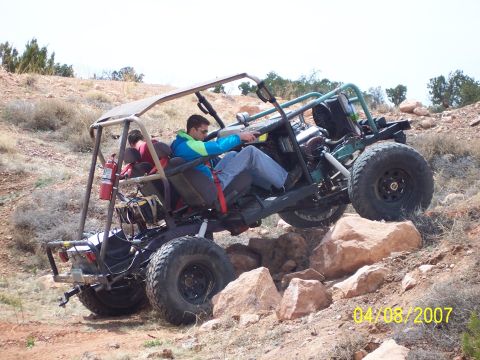 1996 Ford Bronco - This custom off-road buggy navigates a challenging rocky trail with two people on board.