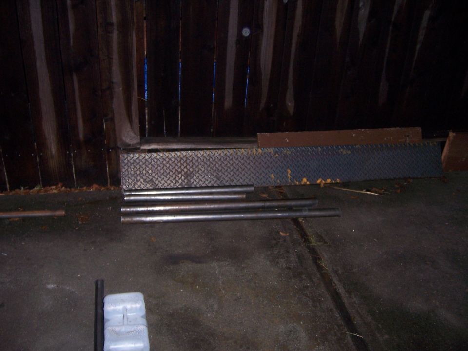 Metal sliders and pipes on concrete floor