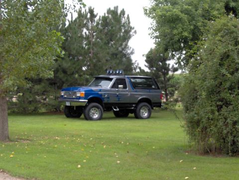 1987 Ford Bronco - This 1987 Ford Bronco features a two-tone paint scheme and auxiliary lighting on its roof.