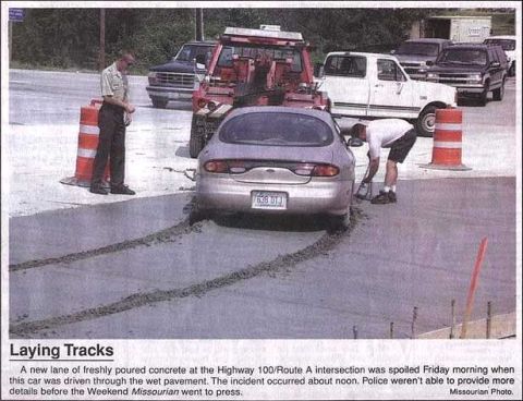 1999 Ford Taurus - A 1999 Ford Taurus leaves tire tracks in freshly poured concrete on Highway 100/Route A.