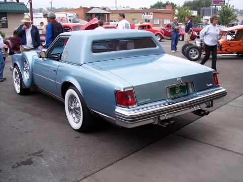 1972 Ford Ranchero - Light blue 1977 Cadillac Eldorado coupe with whitewall tires and wire wheels.