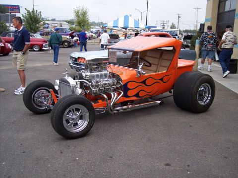1972 Ford Ranchero - Custom hot rod pickup truck with a blown V8 engine and flame graphics on display.