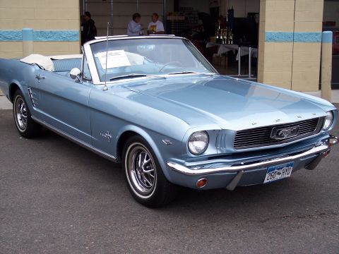 1972 Ford Ranchero - Light blue 1965 Ford Mustang convertible parked outdoors, showing its front 3/4 view.