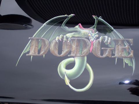 1972 Ford Ranchero - A custom airbrushed dragon adorns the Dodge logo on a dark vehicle.