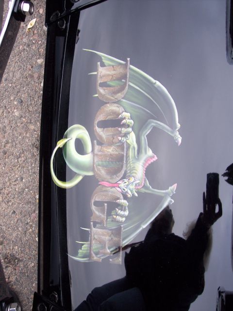 1972 Ford Ranchero - Custom airbrushed dragon and text adorn the hood of a vehicle.