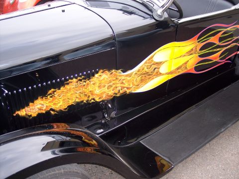 1972 Ford Ranchero - Side view of a black car with custom flame paint job.