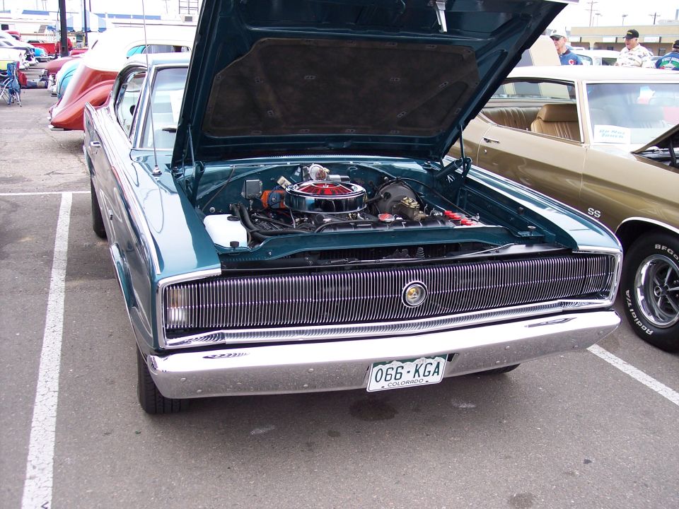 Teal 1967 Dodge Charger front view, hood open revealing engine. License plate 066-KGA