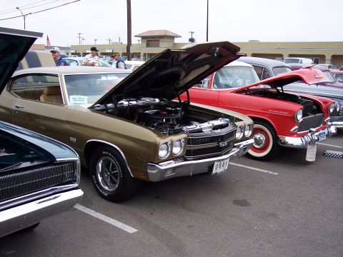 1972 Ford Ranchero - Gold 1970 Chevrolet Chevelle SS shows off its engine at a car show.