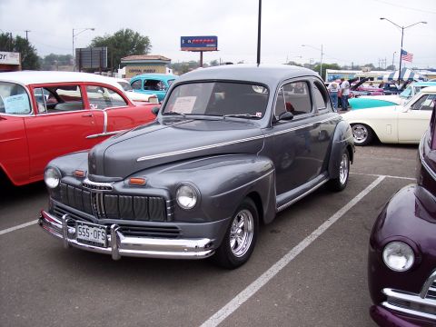 1972 Ford Ranchero - A gray 1947 Mercury coupe is parked at a car show with other vehicles visible.