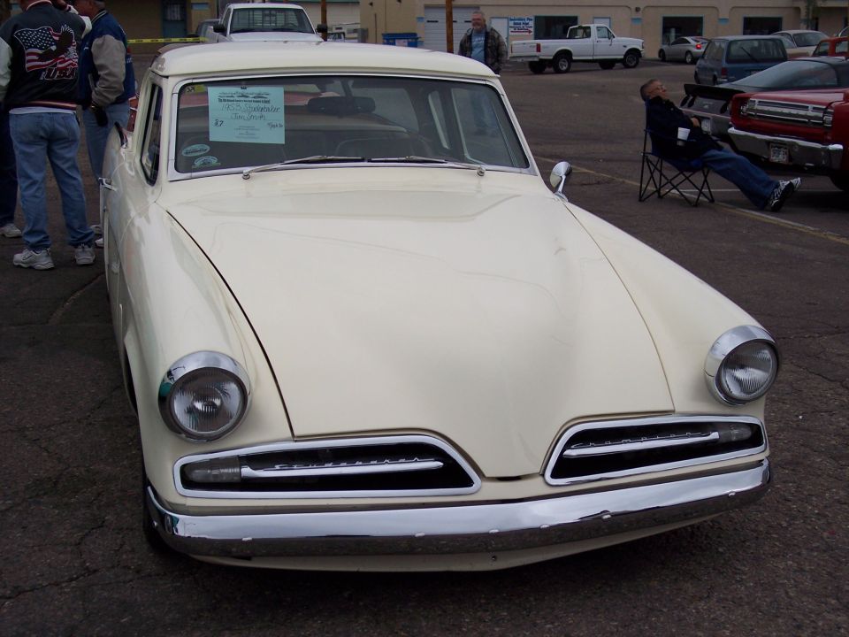 Cream-colored Studebaker pickup truck front end, grille has horizontal bars