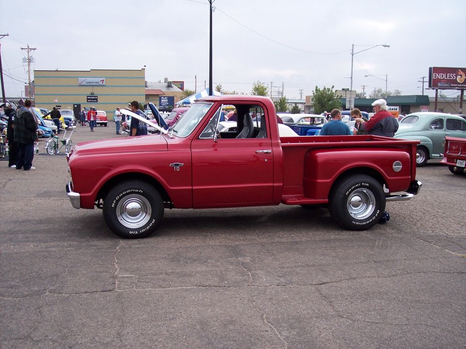 Red pickup truck, side view, with BFGoodrich Radial T/A tires