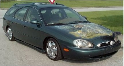 1997 Mercury Sable - This 1997 Mercury Sable station wagon features custom artwork on its hood and shiny chrome wheels.
