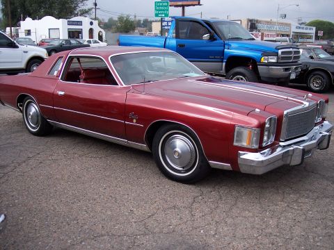 1972 Ford Ranchero - This red 1977 Chrysler Cordoba coupe features distinctive white racing stripes and ample chrome accents.