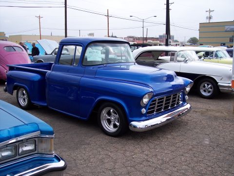 1972 Ford Ranchero - A bright blue pickup truck is parked at an outdoor car show with other vintage vehicles visible.