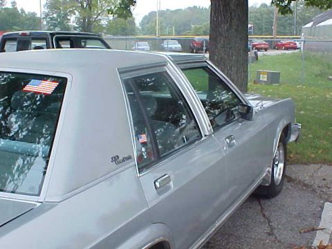 1987 Ford Crown Victoria LTD - Silver 1987 Ford Crown Victoria LTD parked outdoors, showing its side profile.