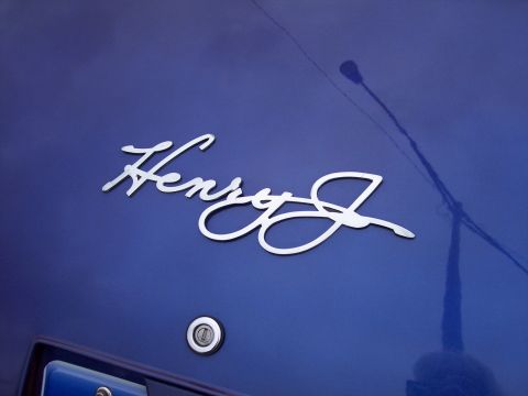 1972 Ford Ranchero - Close-up of a chrome 'Henry J' emblem on the rear of a blue vehicle.
