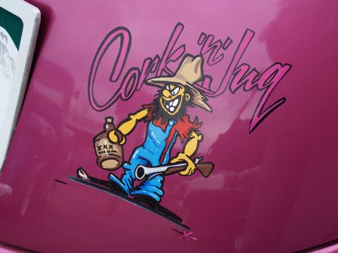 1972 Ford Ranchero - A custom graphic of a cartoon character is displayed on a shiny pink surface.