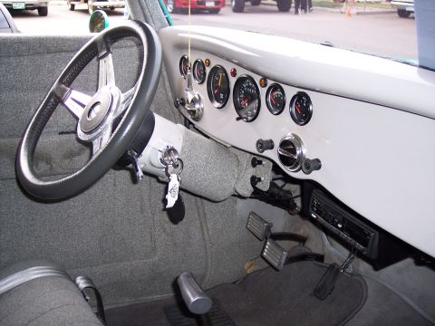 1972 Ford Ranchero - Customized interior features a dashboard with multiple gauges and a steering wheel.