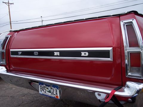 1972 Ford Ranchero - The rear of a red 1972 Ford Ranchero shows its distinctive taillights and chrome bumper.