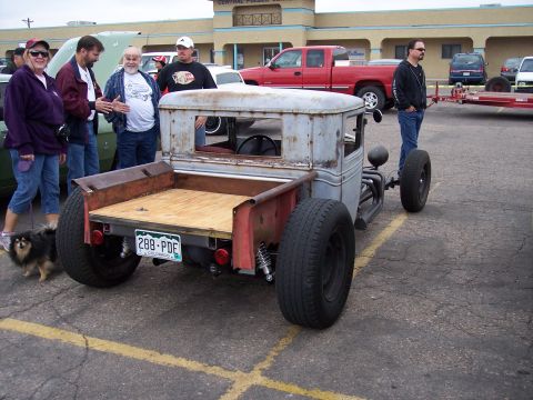 1972 Ford Ranchero - A custom rat rod pickup truck is viewed from the rear, a wooden bed and a Colorado license plate.