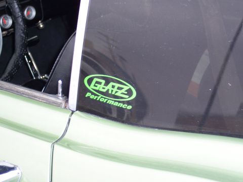 1972 Ford Ranchero - A green oval sticker with 'GLATZ Performance' is visible on the tinted window of a light green vehicle.