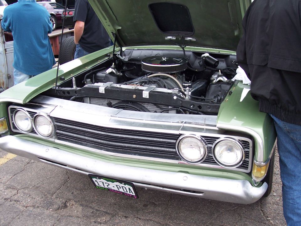 Green 1972 Ford Ranchero front view, hood open showing engine. License plate 172-POA
