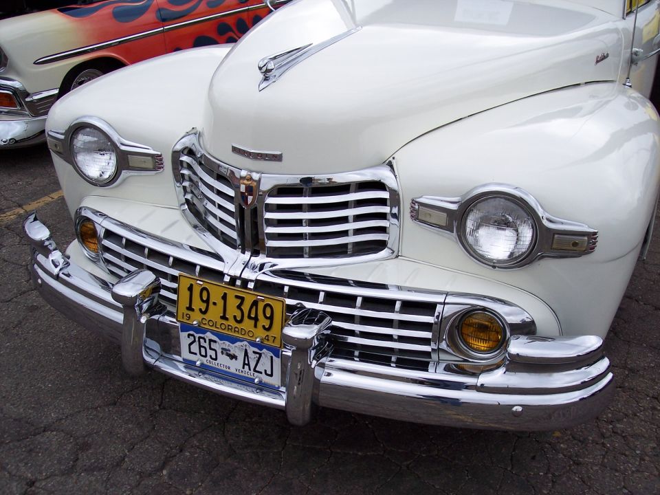 White 1947 Lincoln Continental front end with chrome grille and yellow license plate