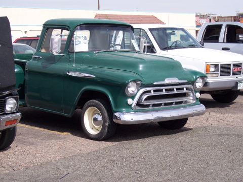 1972 Ford Ranchero - Green 1955 Chevrolet pickup truck with chrome grille and bumper.