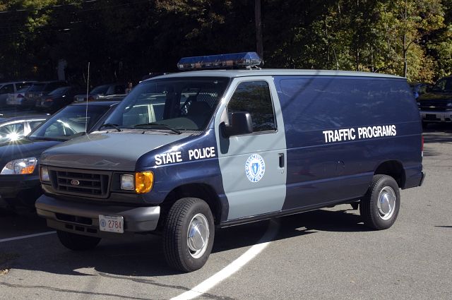 Ford E-Series van, blue and gray, marked STATE POLICE and TRAFFIC PROGRAMS