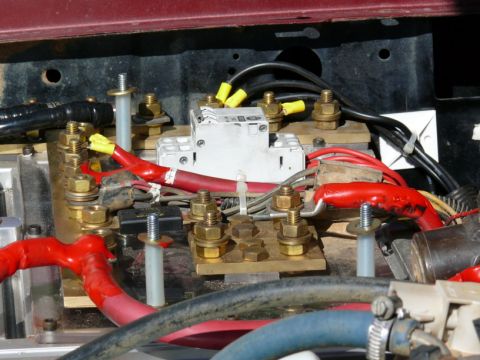 1988 Ford Bronco - Close-up view of a vehicle's battery box wiring, showing electrical components and connections.