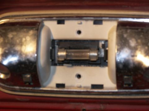 1978 Ford Bronco - This photo shows the fuse within a vehicle's interior dome light housing.