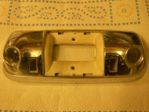 1978 Ford Bronco - Dome light assembly removed from a vehicle for disassembly.