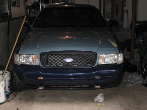 1991 Ford LTD Crown Victoria - The front end of a 1991 Ford Crown Victoria LTD, a prominent Ford grille and dual headlights.