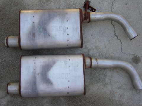 1983 Ferrari Enzo - Two Flowmaster exhaust mufflers are shown, with the brand name visible on each. The registry incorrectly identifies them as a 1983 Ferrari…