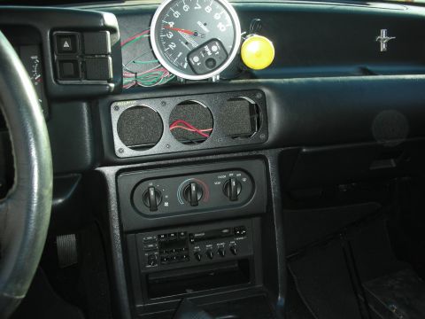 1998 Ford Crown Victoria - Car interior shows an aftermarket tachometer and a pod for additional gauges.