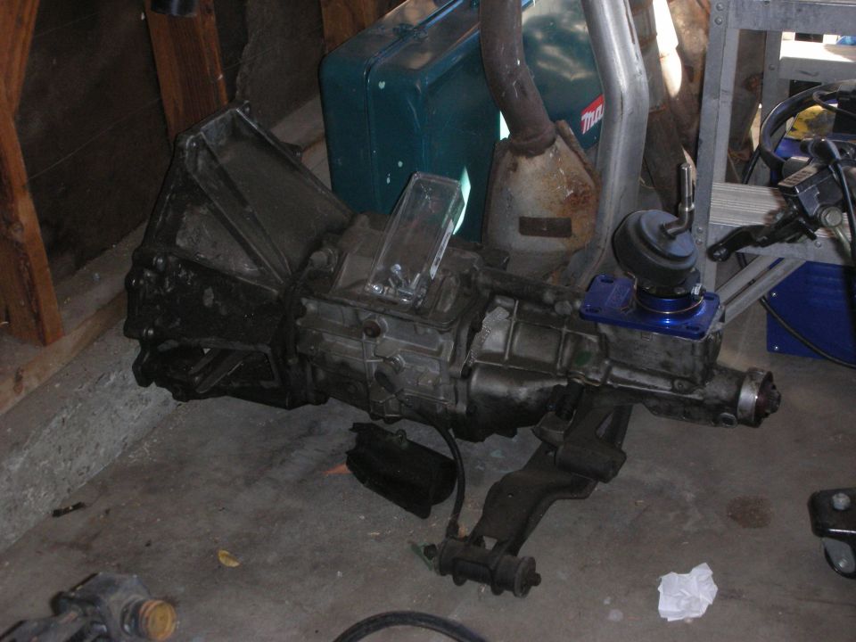 Manual transmission with bellhousing sitting on a garage floor