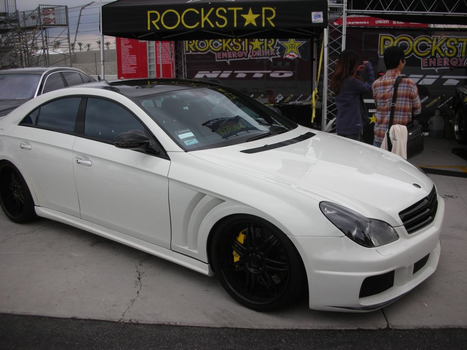 White Mercedes-Benz CLS with body kit and black wheels at Rockstar booth