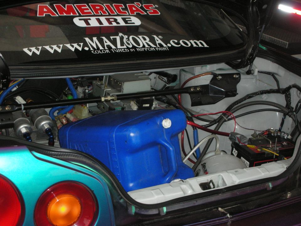 Open rear hatch showing blue fuel cell, battery and wiring