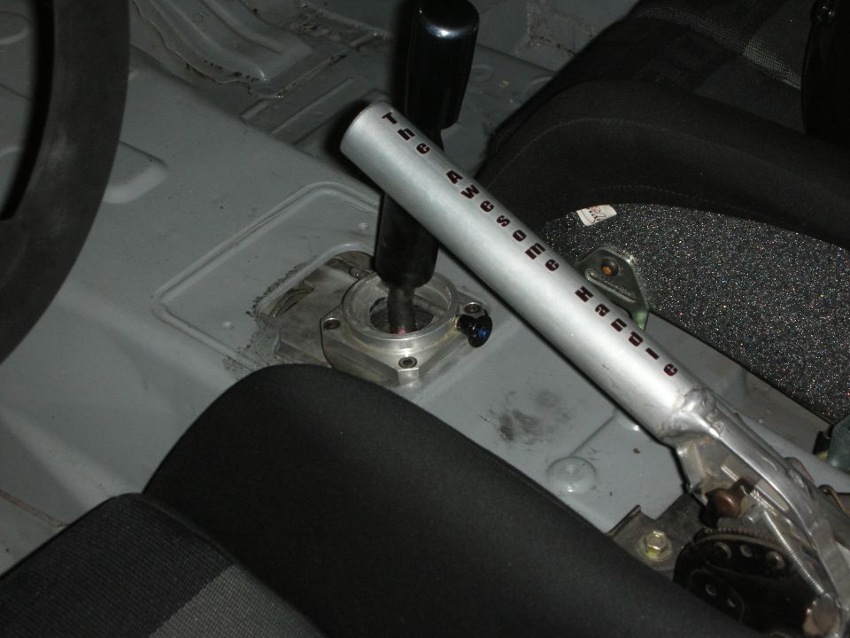 Tall aluminum sequential-style shifter in stripped interior
