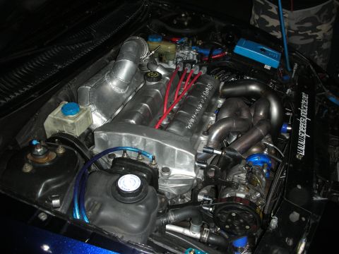 1998 Ford Crown Victoria - Custom engine bay modifications visible, including polished intake and turbo plumbing.