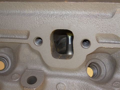 1994 Ford Bronco - This is a close-up view of an engine cylinder head, showing the ports for intake and exhaust.