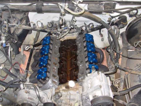 1994 Ford Bronco - V8 engine with aftermarket blue roller rocker arms installed during a rebuild.